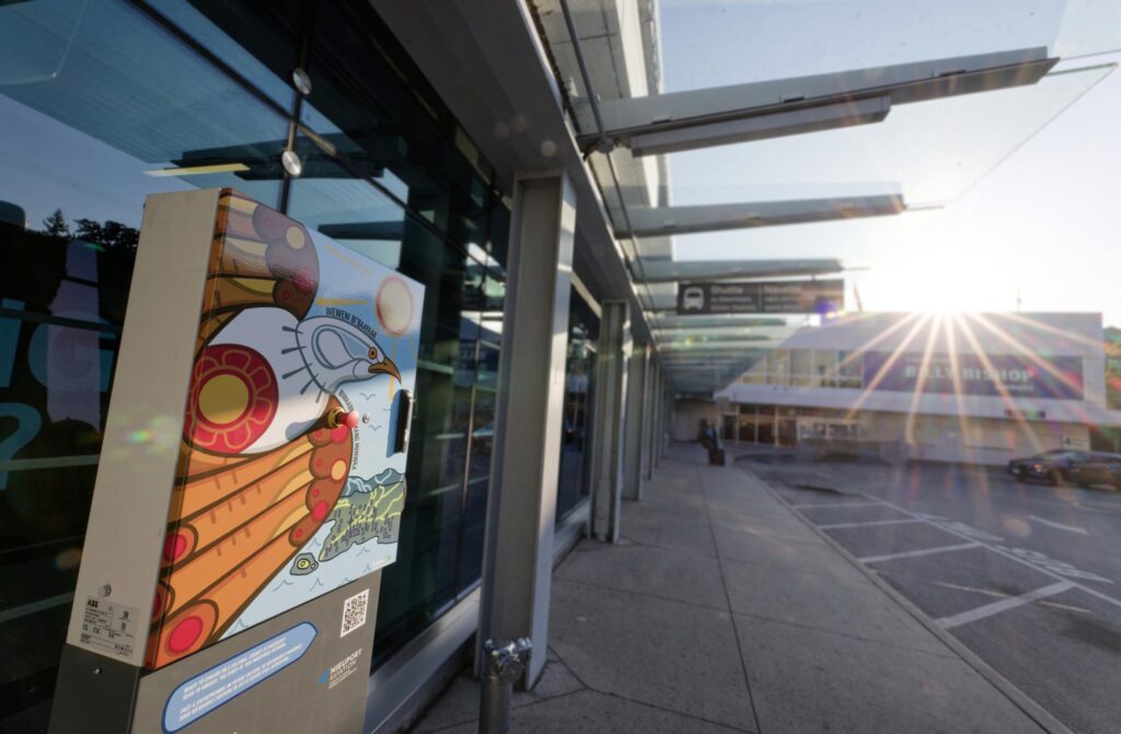 indigenous artwork outside of airport on a sunny day
